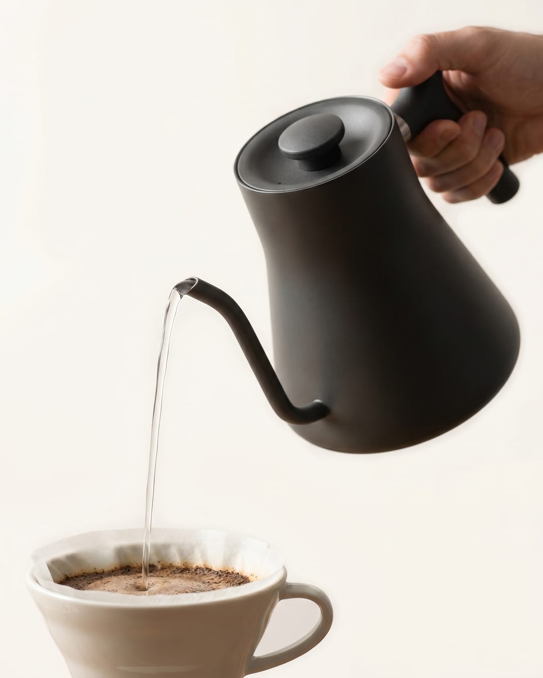 A steady laminar stream pouring into a ceramic dripper
